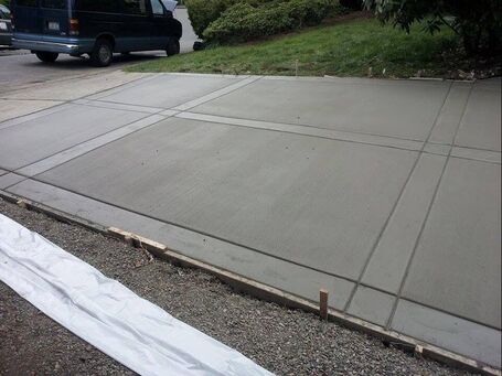 A freshly finished concrete driveway 
